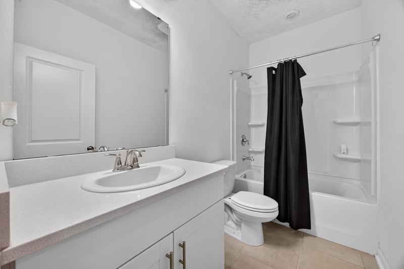Bathroom with single vanity and tub-shower combo at 339 Anthony Dr, Jacksonville, FL