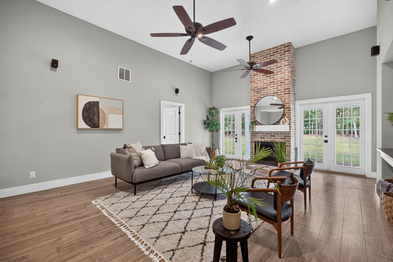 Living room with fireplace and open floor plan at 1161 Whispering Pines Rd, Jacksonville, FL 32259
