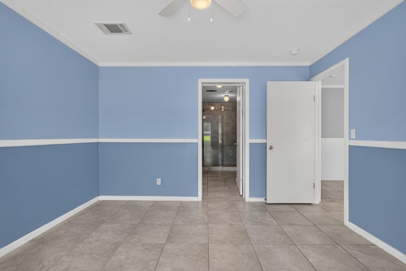 Bedroom with doorway to hallway at 2549 Snapdragon Ave, Middleburg, FL 32068