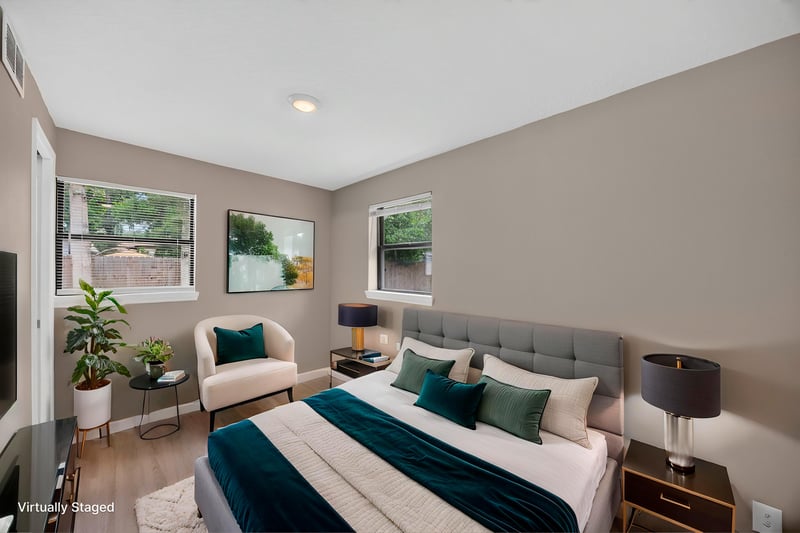 Virtually staged bedroom with teal bedding and seating area at 184 Draco St, Orange Park, FL 32073