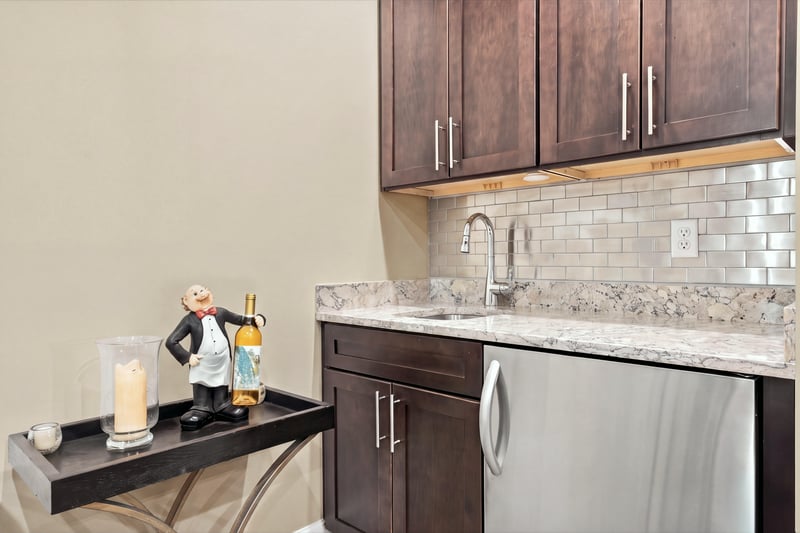 Wet bar with wine refrigerator, photographed by Megapixeler on Lucena Ln, Jacksonville, FL