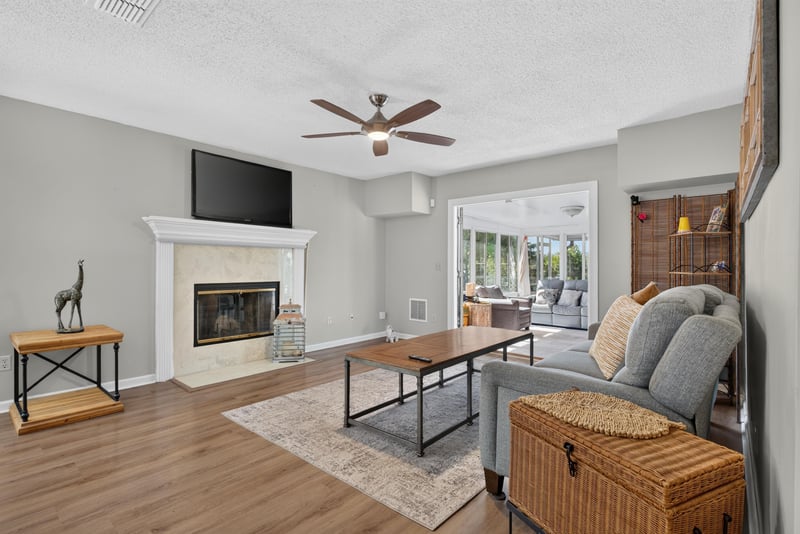 Living room with fireplace and open layout at 8680 Bandera Cir S, Jacksonville, FL 32244