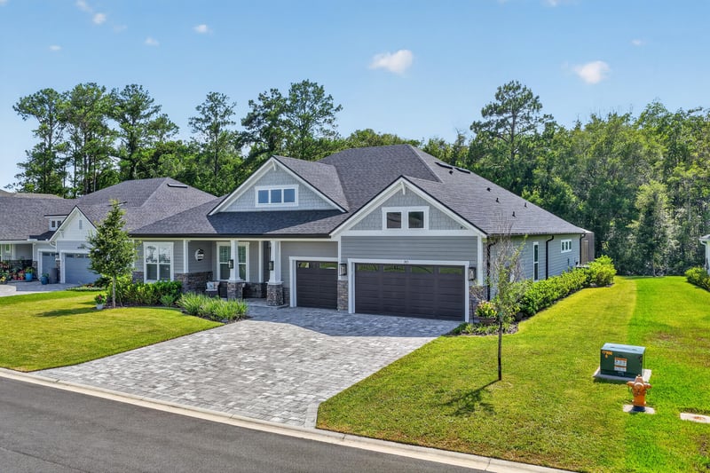 Aerial view of the driveway and side yard at 785 Back Creek Dr, St. Augustine, FL 32092