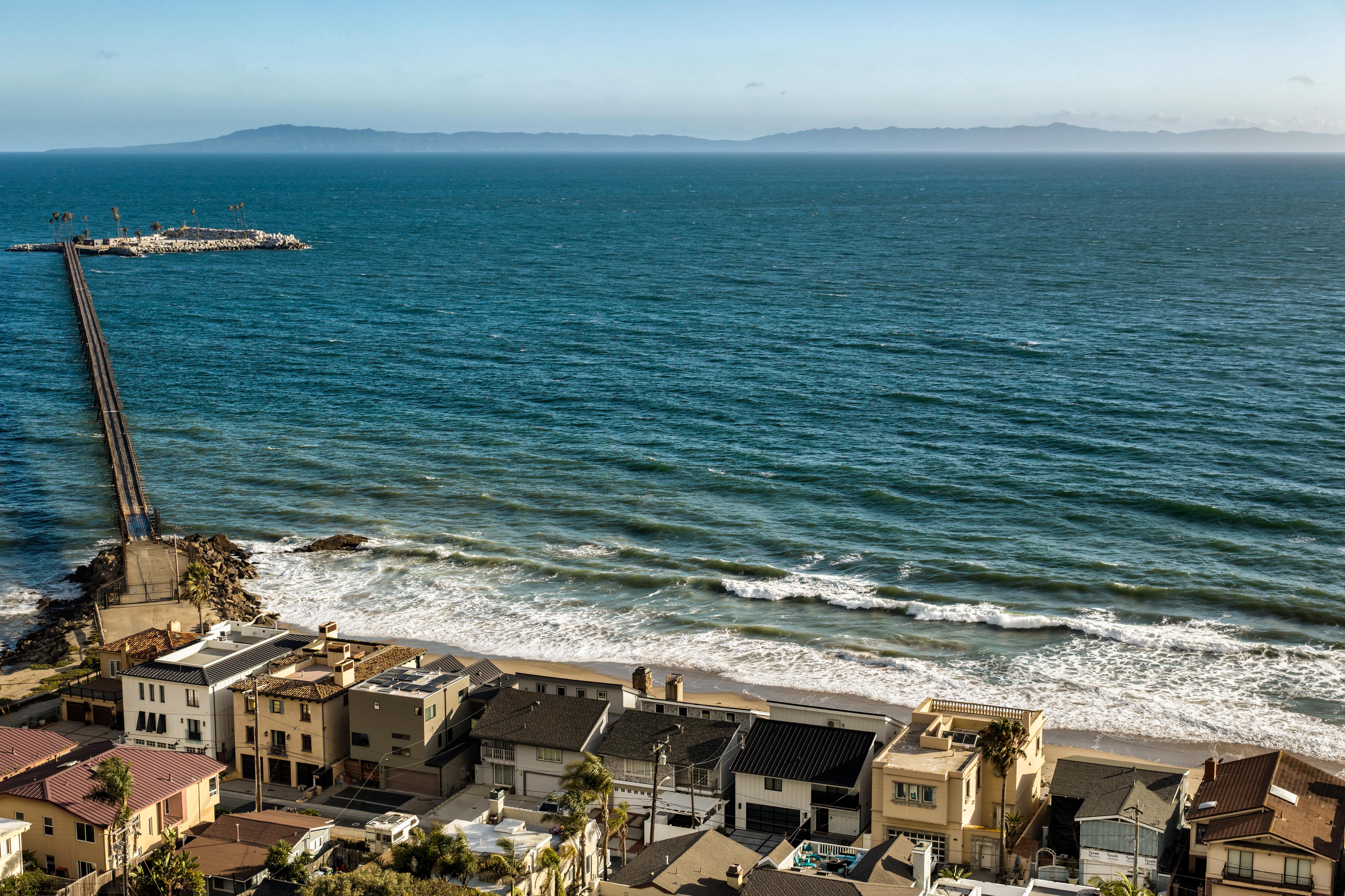 Real estate drone photography of 6726 Breakers Way, Ventura CA — aerial views reveal the property's rare positioning along the Ventura coastline with sweeping Channel Islands panoramas beyond. Our team captured still photography, aerial drone photography with Inspire 3 Cinema Drone, FPV clips, a cinematic property video with agent narration, a Matterport virtual tour, a Zillow Showcase, a true vertical social media reel, and floor plan scan throughout the early morning.