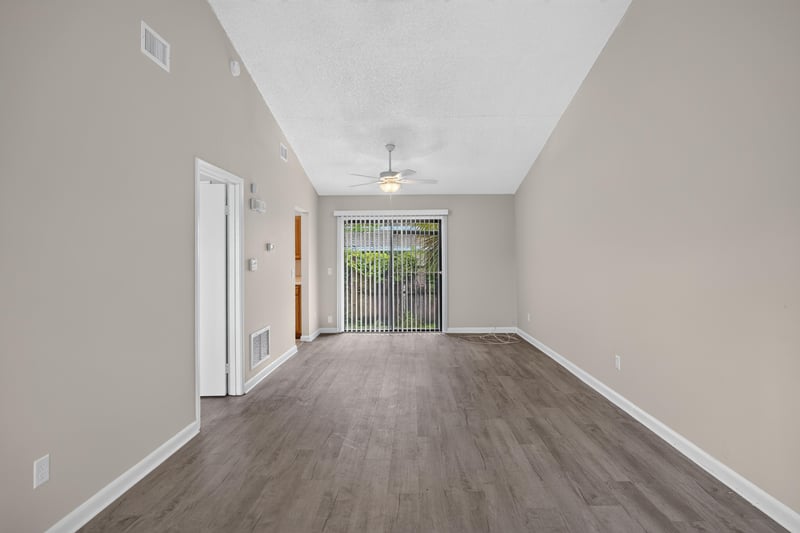 Open living space with window and wood-look floor at 2717 Trollie Ln, Jacksonville, FL