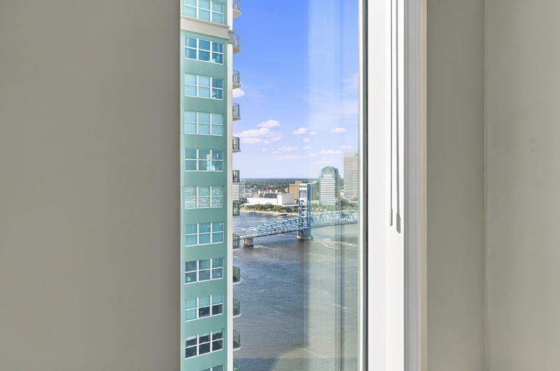 Window view of the river and city towers, photographed by Megapixeler on Riverplace Blvd, Jacksonville
