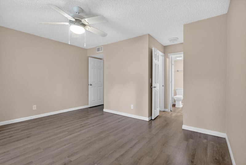Empty room with ceiling fan and doorway to bathroom at 5811 Atlantic Blvd unit 47, Jacksonville, FL 32207