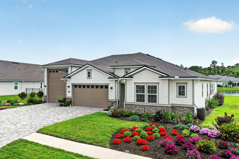Front exterior with colorful landscaping at 85491 Fall River Pkwy, Fernandina Beach, FL 32034