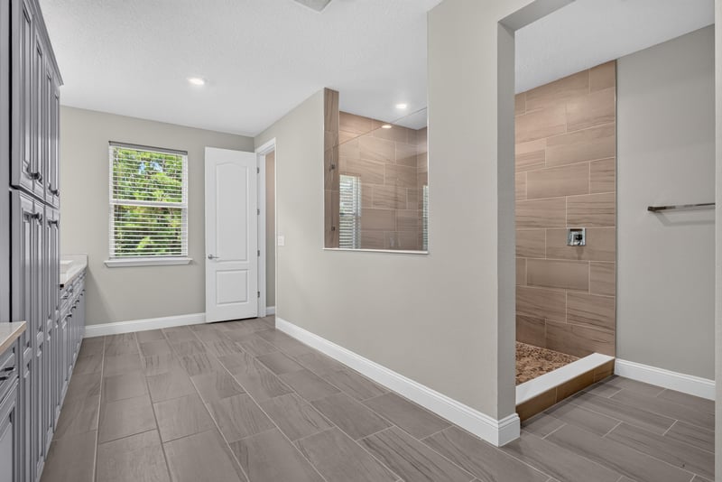 Primary bathroom shower entry at 22 Azura Point