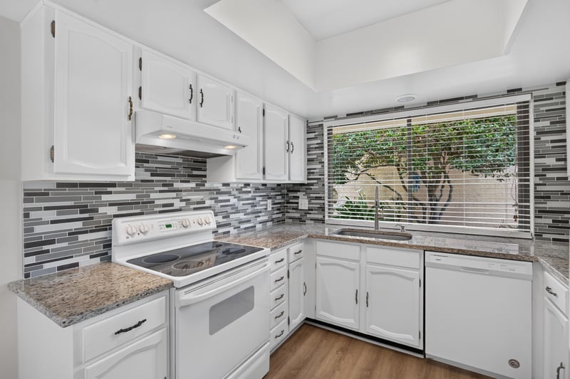 Kitchen window over sink and cabinetry at 3407 Fairbanks Grant Rd N, Jacksonville, FL 32223