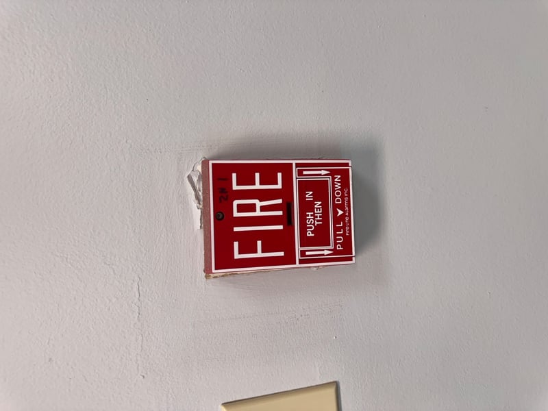 Fire alarm pull station on wall at 11700 New Kings Rd, Jacksonville, FL 32219