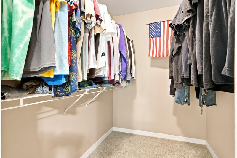 Closet with hanging clothes and shelving at 7800 Point Meadows Dr, Jacksonville, FL 32256