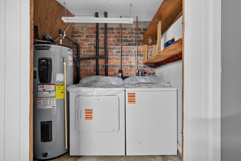 Laundry room with washer, dryer and water heater at 9954 Larkdale Ct, Jacksonville, FL 32257