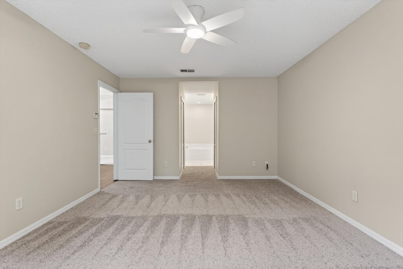 Hallway with carpet and doorway at 1648 Glen Laurel Dr, Middleburg, FL 32068