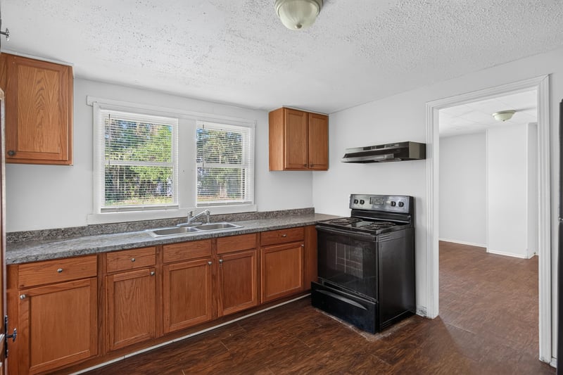 Kitchen with range and wood cabinets at 2372 2nd Ave, Jacksonville, FL 32208