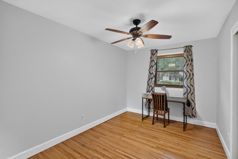 Bedroom with desk and chair by window at 1847 Grove Park Dr, Orange Park, FL