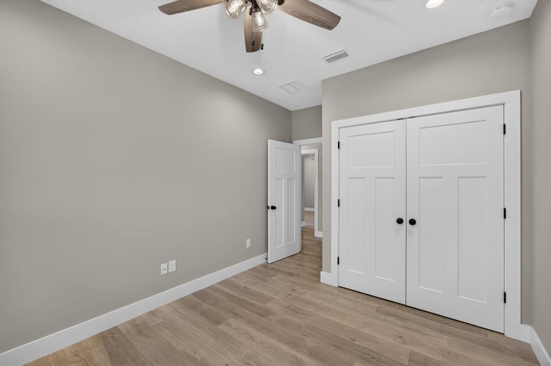 Bedroom with closet doors and ceiling fan at 175 Alava Ct