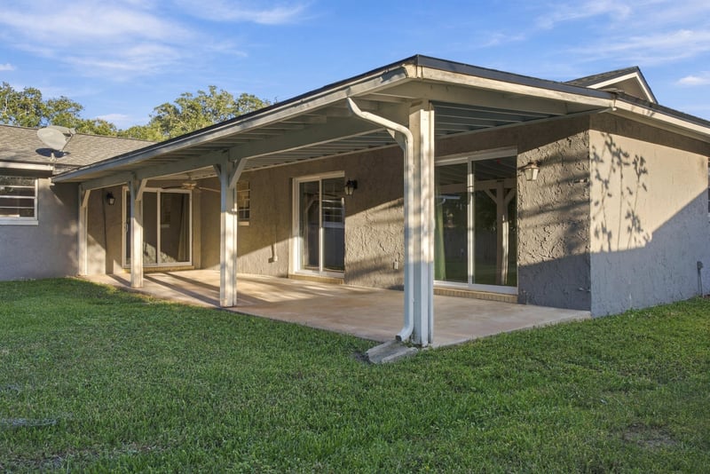 Covered patio exterior view of the home, photographed by Megapixeler on Crosby Ln, Orange Park