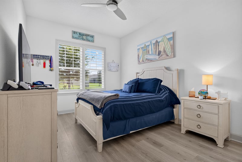 Secondary bedroom with blue bedding at 785 Back Creek Dr, St. Augustine, FL 32092