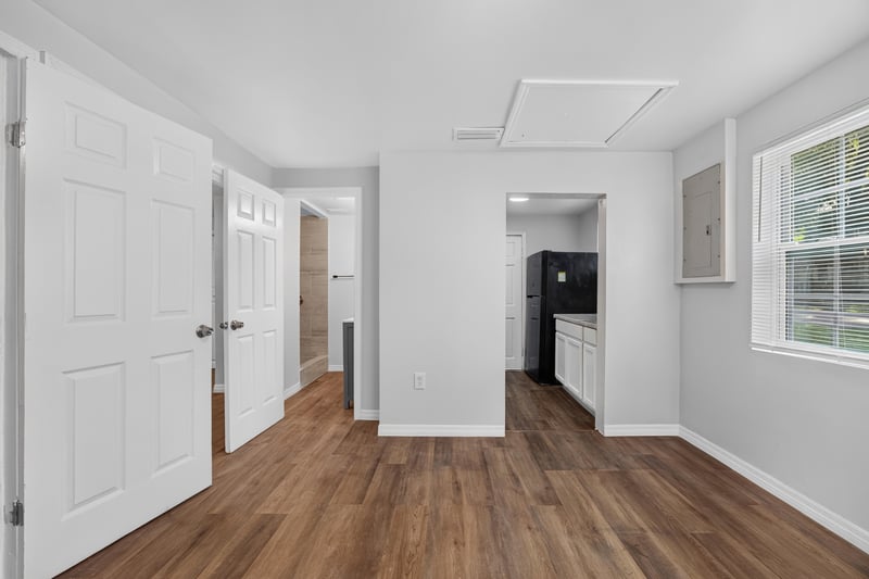 Hallway toward kitchen with closet doors at 4951 Halls Dr