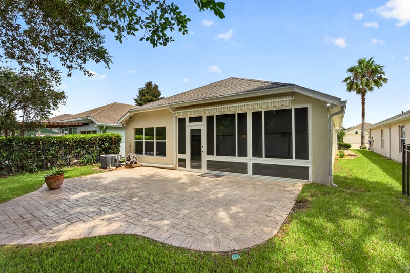 Backyard paver patio and screened porch at 11225 Water Spring Cir, Jacksonville, FL 32256