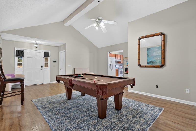 Living room with pool table and hallway closets at 8680 Bandera Cir S, Jacksonville, FL 32244