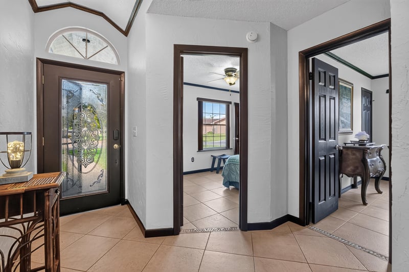 Entry hallway with tile floor at 6931 Cane Grass Ln E, Jacksonville, FL 32244