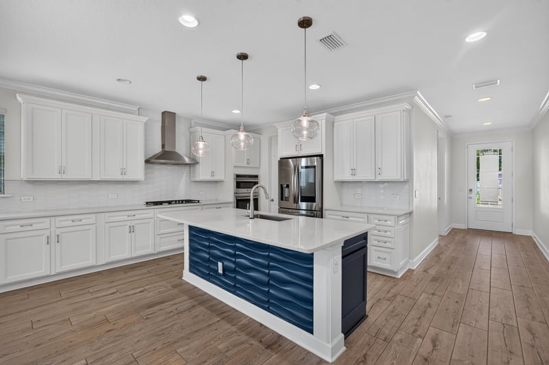Kitchen island with subway tile backsplash at 855 Flach Dr, St. Johns, FL