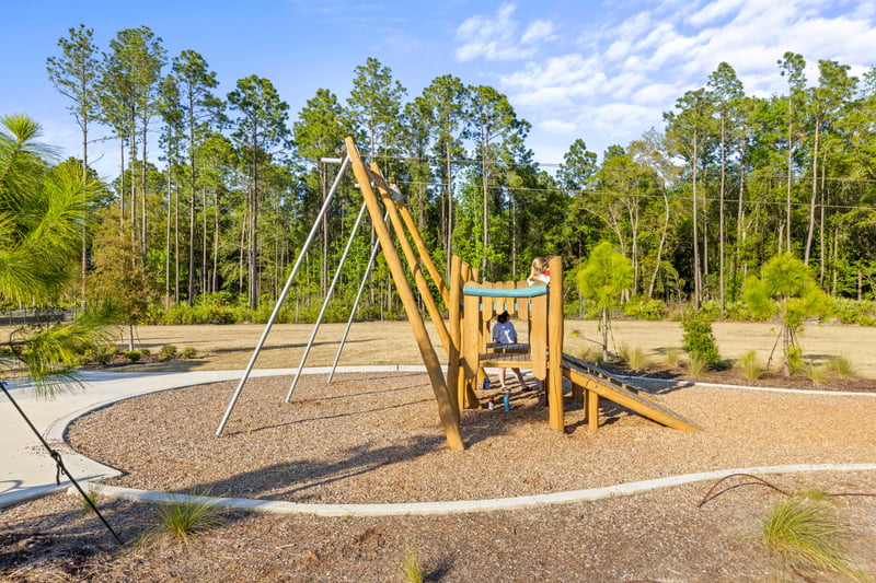 Community playground with swings in St. Johns, FL