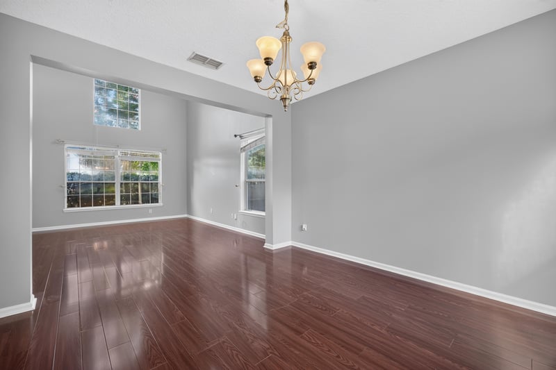 Dining room with chandelier, wood floors at 470 Sparrow Branch Cir, Jacksonville, FL 32259