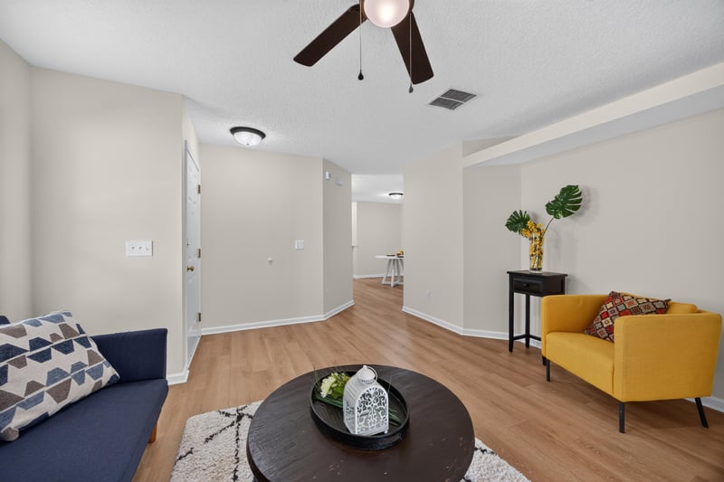 Living room with vaulted ceiling at 605 N Covered Bridge Rd, Jacksonville, FL