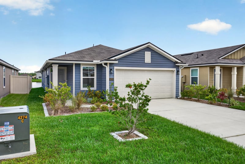 Front exterior with driveway and garage at 4276 Quaking St, Jacksonville, FL 32218