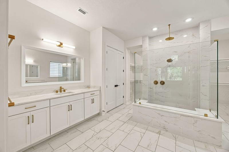 Primary bath with window and dual vanities at 907 Seagrove Dr, Ponte Vedra Beach, FL 32081