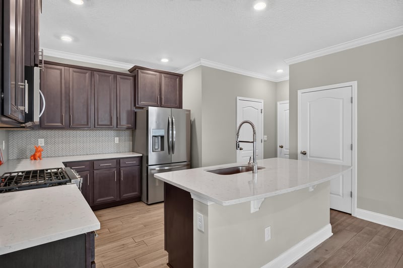 Kitchen with stainless range and tile backsplash at 331 Millerstone Dr, St. Augustine, FL 32092